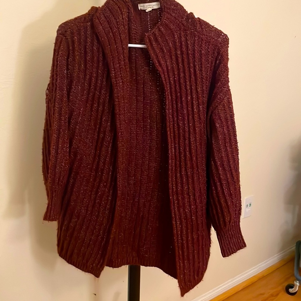 A dark red sweater cardigan